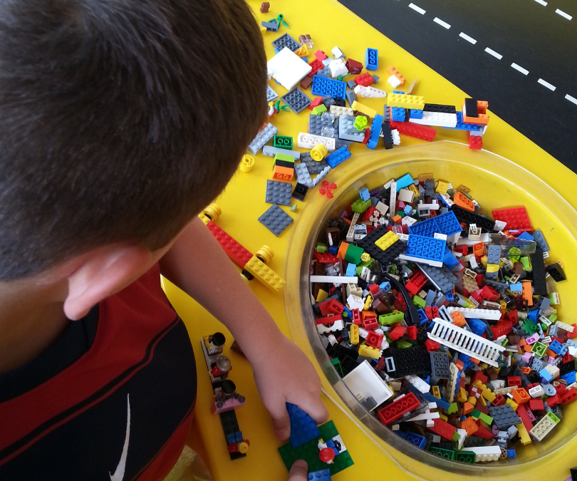 A child playing with LEGOS