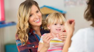 Parent and child doing sign language