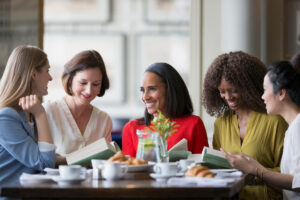 A group of women discussing a book