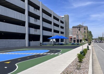 The Fringe's blue umbrellas as seen from the bike rodeo painted surface