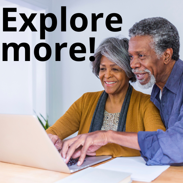 Two senior adults working on a laptop