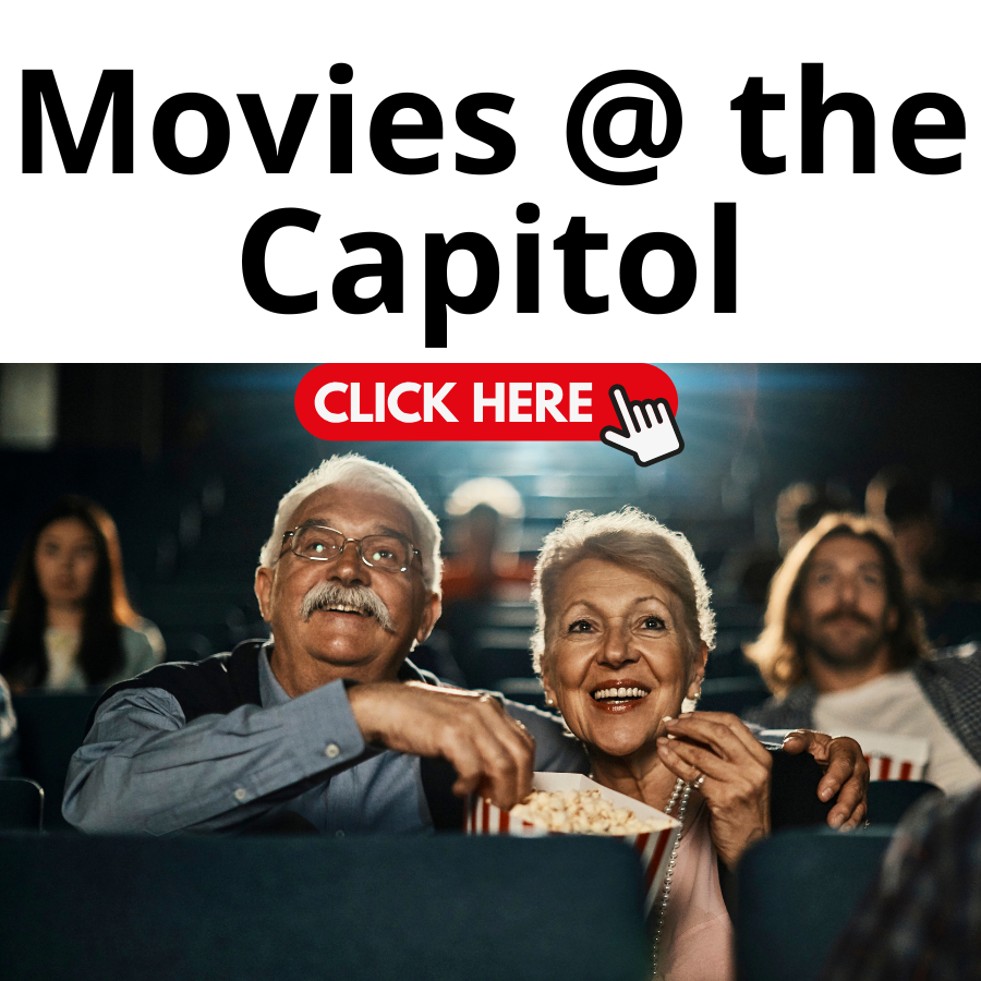 People watching a movie in a theater eating popcorn