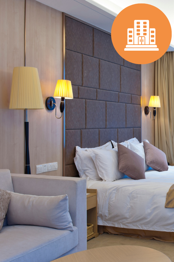 hotel room with lights and bed