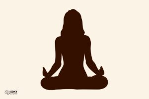 a silhouette of a person in a yoga pose
