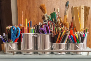 Metal cups full of crafting materials
