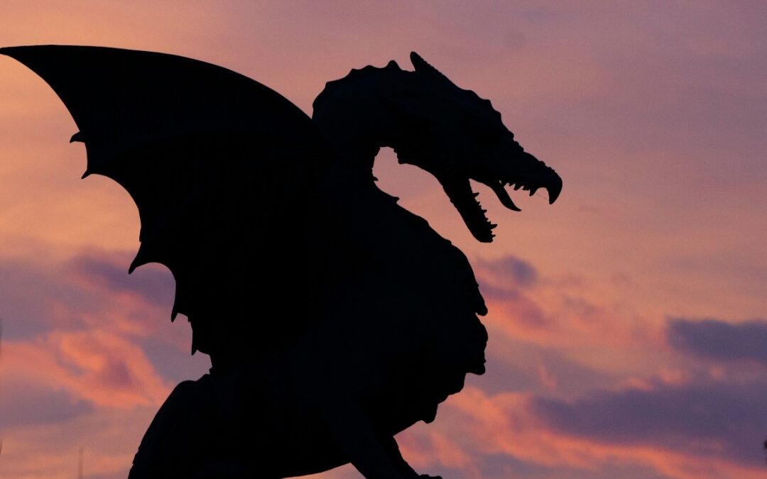 dragon silhouette against a sunset