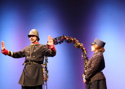 An official holding up his hands in a stop motion