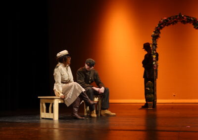 Two people on a bench talking
