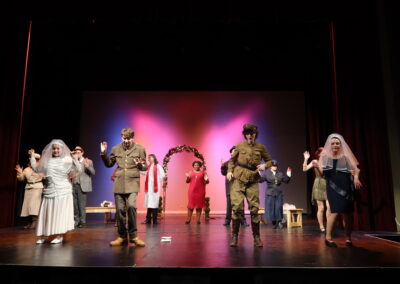 The entire cast dancing