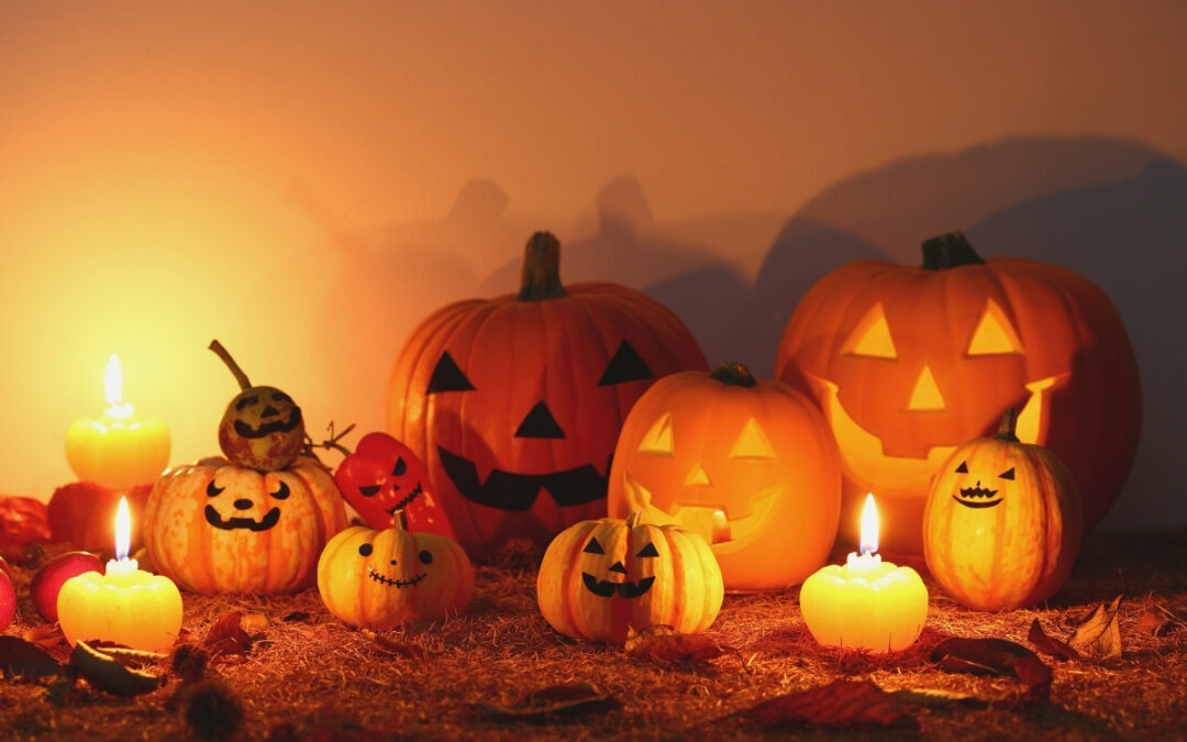 Festive Jack-o-lanterns atop an orange background